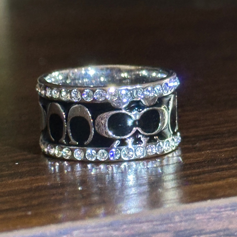 Coach Ring sz 6. Band with logo framed in rhinestones. Silver and black